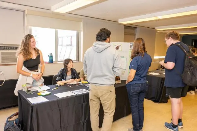 Students tabling and interacting with other students 